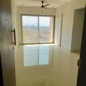 Living Room in 1 BHK Apartment at RS QA Riverfront, Taloja – for Rent