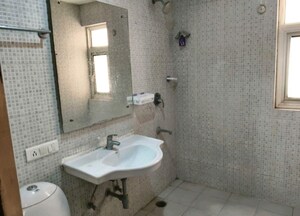 Bathroom in 3 BHK Apartment at Omaxe Palm Greens, Mu Greater Noida – for Rent
