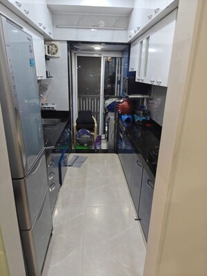Kitchen in 2 BHK Apartment at Paradigm Ananda Residency, Borivali West – for Sale