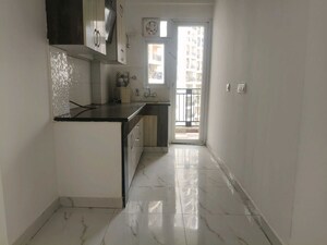 Kitchen in 3 BHK Apartment at Casa Woodstock, Sector 16c Greater Noida – for Sale