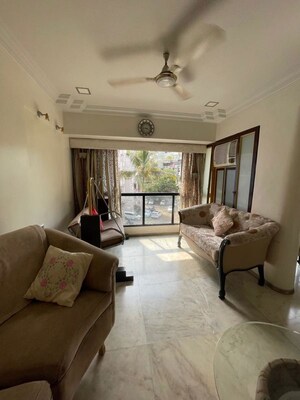 Living Room in 1 BHK Apartment at New Neelam CHS, Andheri West – for Sale