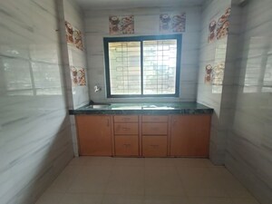 Kitchen in 1 BHK Apartment at RNA NG Regency Phase I, Balkum Pada – for Sale