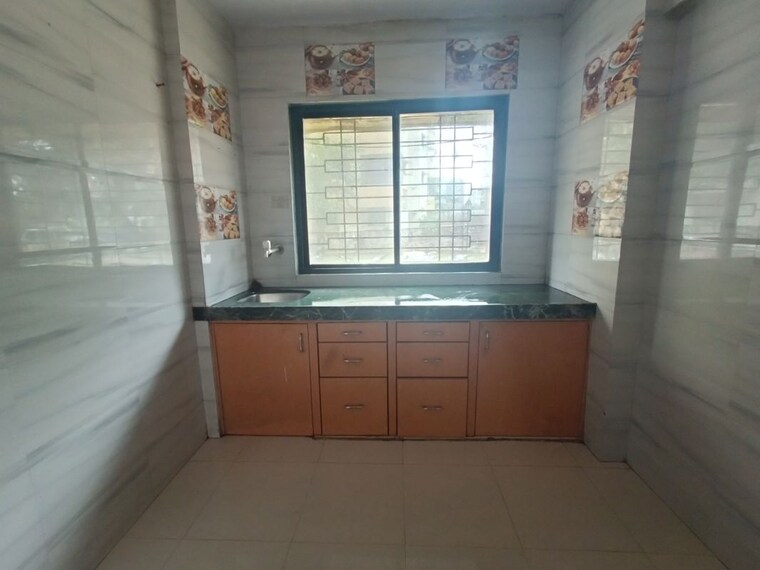 Kitchen, rna-ng-regency-phase-i 1 Bedroom 585 Sq.Ft. Apartment In Balkum Pada Thane 10402128