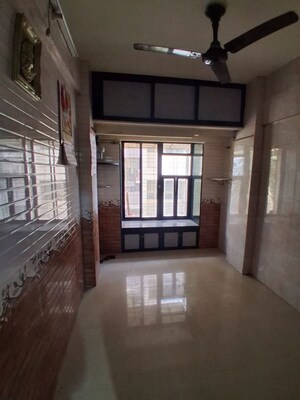 Room in 2.5 BHK Apartment at Unique Garden CHS, Malad West – for Rent