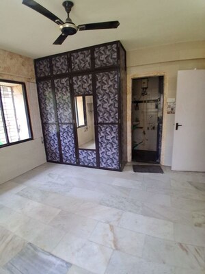 Room in 2.5 BHK Apartment at Unique Garden CHS, Malad West – for Rent