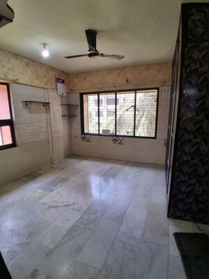 Room in 2.5 BHK Apartment at Unique Garden CHS, Malad West – for Rent
