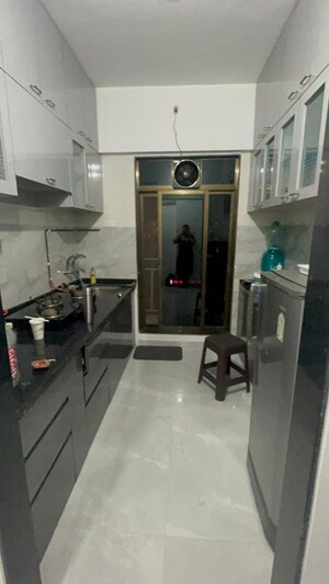 Kitchen in 2 BHK Apartment at Tulsi Park, Khadakpada – for Rent