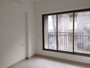 Room in 2 BHK Apartment at Tarapore Gardens, Andheri West – for Rent