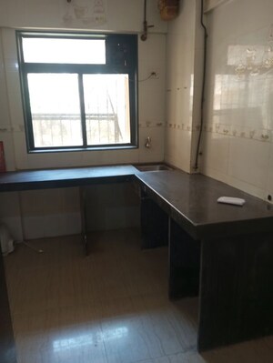 Kitchen in 1 BHK Apartment at Raunak Unnathi Woods Phase 4 And 5, Ghodbunder Road – for Rent