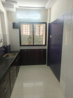 Kitchen in 2 BHK Apartment at Gahlot Majesty and Avenue CHS, Seawoods – for Rent