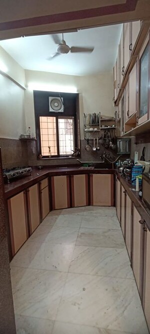 Kitchen in 1 BHK Apartment at New Marine Lines – for Sale