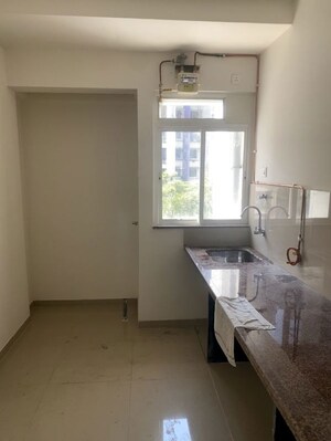 Kitchen in 1 BHK Apartment at Puranik Hometown, Ghodbunder Road – for Rent