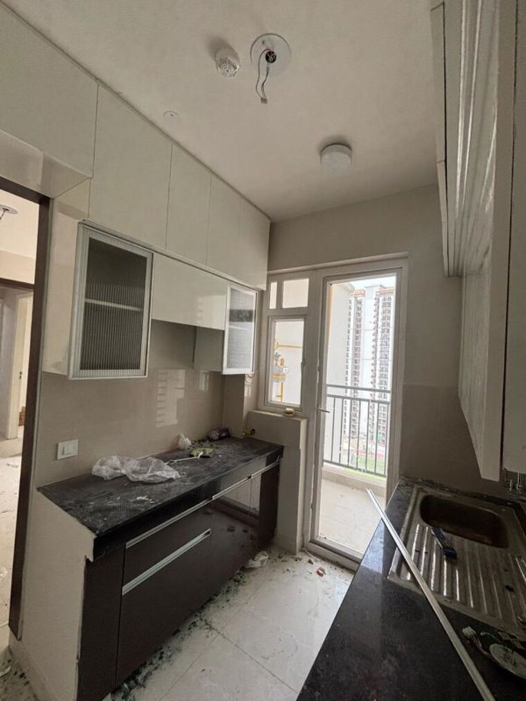 Kitchen, eldeco-live-by-the-greens 2 Bedroom 1100 Sq.Ft. Apartment In Sector 150 Noida 10405627