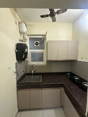 Kitchen in 2 BHK Apartment at Jaipuria Sunrise Green, Lohgarh – for Rent