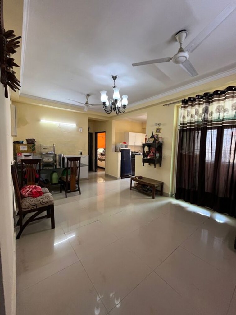 Living Room, amrapali-silicon-city 2.5 Bedroom 1180 Sq.Ft. Apartment In Sector 76 Noida 10406161