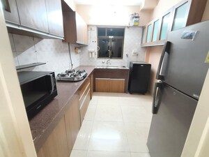 Kitchen in 2 BHK Apartment at Jasmine Tower, Vasant Vihar – for Rent