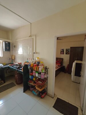 Living Room in 1 BHK Apartment at Indraprashta CHS, Dhanori – for Rent
