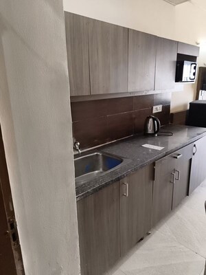Kitchen in 1 RK Apartment at Paramount Golf Forest Studio Apartments - OAK Towe, Zeta I Greater Noida – for Rent