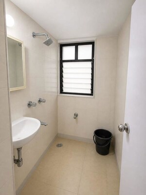 Bathroom in 1 BHK Apartment at Parijat Paragon, Andheri West – for Sale