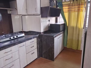 Kitchen in 2 BHK Apartment at Yashodeep Castle CHS, Oshiwara – for Rent