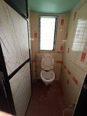 Bathroom in 1 BHK Apartment at Jai Om Gurumauli CHS, Dombivli West – for Rent