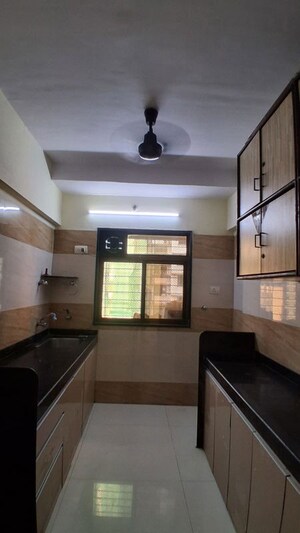 Kitchen in 2 BHK Apartment at DGS Sheetal Sati Smruti, Malad East – for Rent