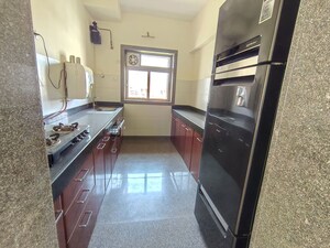 Kitchen in 2.5 BHK Apartment at Kalpataru Siddhachal Elegant, Vasant Vihar – for Rent