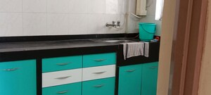 Kitchen in 2 BHK Apartment at Sai Dham CHS, Dhanori – for Rent