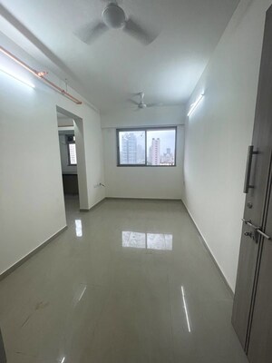 Building Lobby in 1 BHK Apartment at Satellite Garden, Goregaon East – for Rent