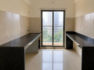 Kitchen in 2 BHK Apartment at Vikash Complex CHS, Uthalsar – for Rent