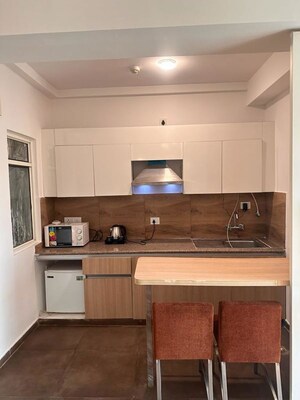 Kitchen in Studio Apartment at Nimbus The Golden Palm, Sector 168 – for Rent