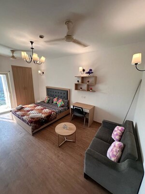 Living Room in Studio Apartment at Nimbus The Golden Palm, Sector 168 – for Rent