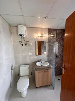 Bathroom in Studio Apartment at Nimbus The Golden Palm, Sector 168 – for Rent
