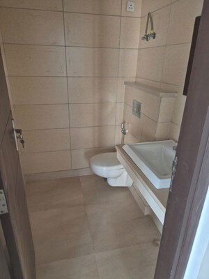 Bathroom in 4 BHK Apartment at Puri Diplomatic Greens Phase I, Sector 111 – for Rent