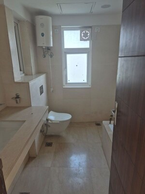 Bathroom in 4 BHK Apartment at Puri Diplomatic Greens Phase I, Sector 111 – for Rent
