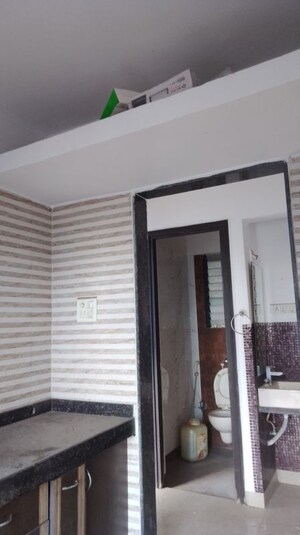 Building Lobby in 1 BHK Apartment at Tharwani Vedant Millenia, Titwala – for Rent