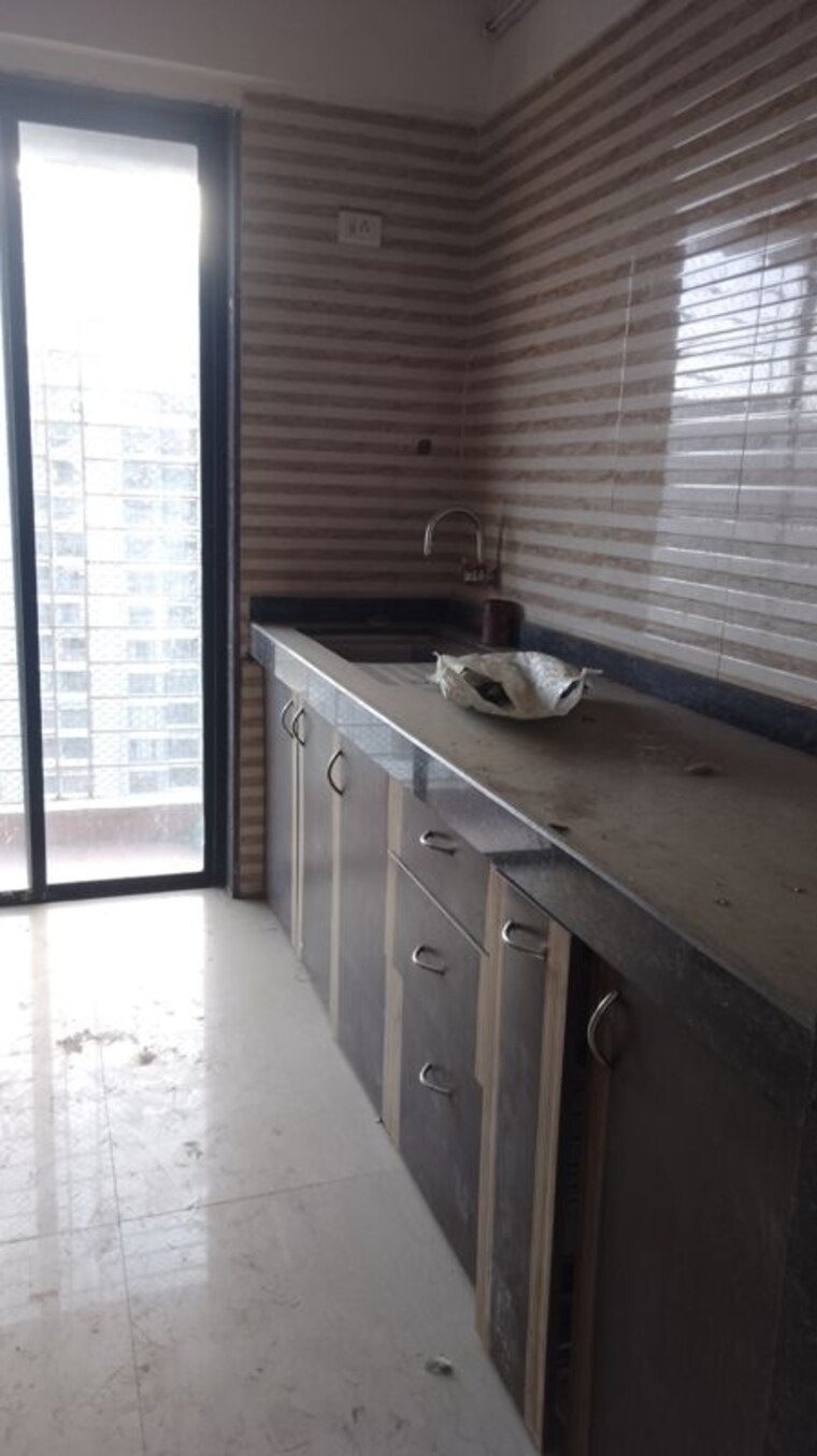 Kitchen, tharwani-vedant-millenia 1 Bedroom 650 Sq.Ft. Apartment In Titwala Thane 10410137
