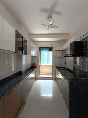 Kitchen in 2 BHK Apartment at Asmita Sand Dunes, Malad West – for Rent