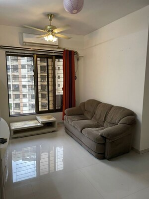 Living Room in 1 BHK Apartment at Haware Dahlia, Kasarvadavali – for Rent