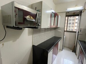Kitchen in 1 BHK Apartment at Haware Dahlia, Kasarvadavali – for Rent