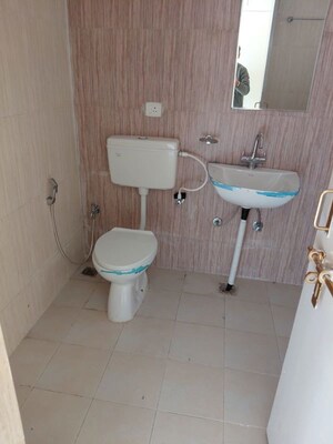 Bathroom in 2 BHK Apartment at Raj Nagar Extension – for Sale