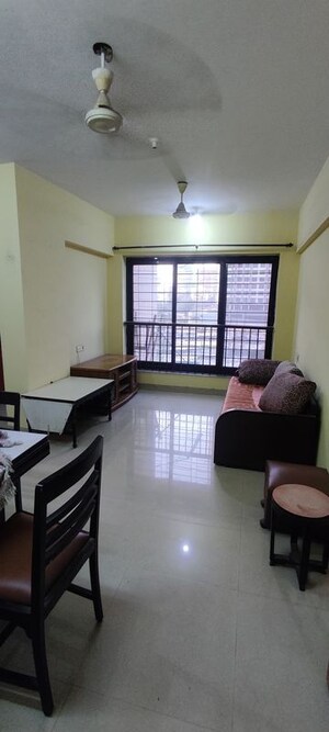 Living Room in 1 BHK Apartment at K Raheja Palm Court J Building, Malad West – for Rent