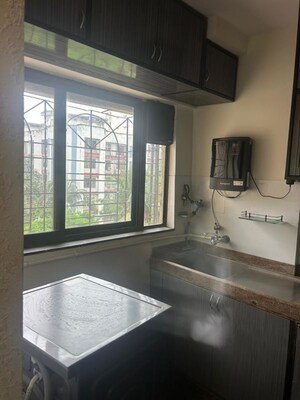 Bedroom in 2 BHK Apartment at Lokhandwala Complex – for Rent