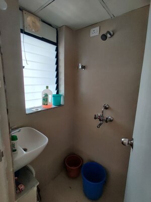Bathroom in 1 BHK Apartment at Runwal Gardens, Dombivli East – for Rent