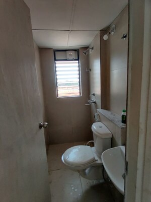 Bathroom in 1 BHK Apartment at Runwal Gardens, Dombivli East – for Rent