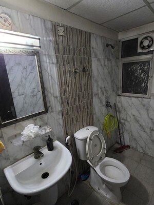 Bathroom in 2.5 BHK Apartment at Amrapali Silicon City, Sector 76 – for Sale