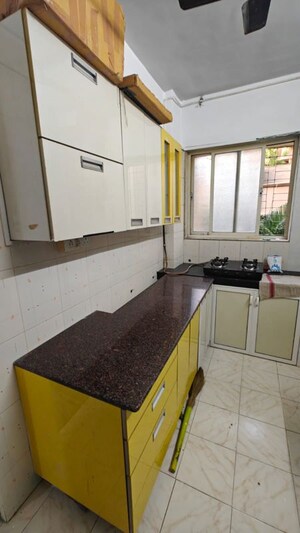 Kitchen in 2 BHK Apartment at Takshila CHS, Andheri East – for Rent