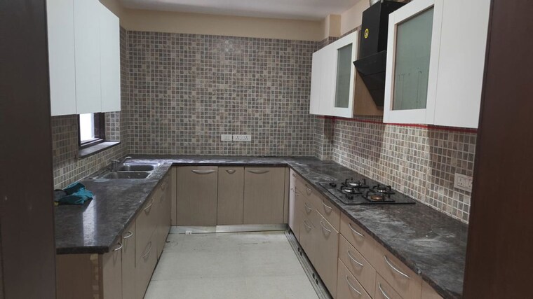 Kitchen, unitech-uniworld-resorts-the-residences 3.5 Bedroom 1450 Sq.Ft. Apartment In Sector 33 Gurgaon 10411795
