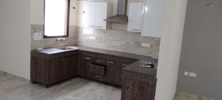 Kitchen, unitech-uniworld-resorts-the-residences 3.5 Bedroom 1450 Sq.Ft. Apartment In Sector 33 Gurgaon 10411795