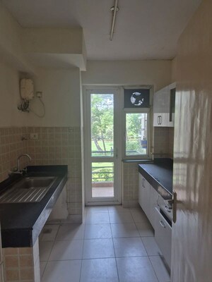 Kitchen in 3 BHK Apartment at Mahindra Aura, Sector 110a – for Rent